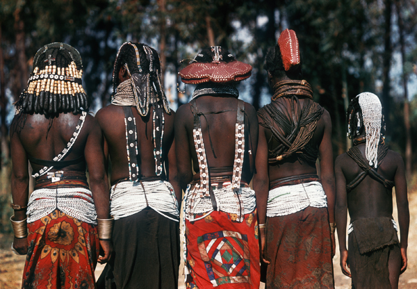 Mwila women display hairstyles symbolizing various stages of a woman's life, near Humpata, Angola, 1959/60